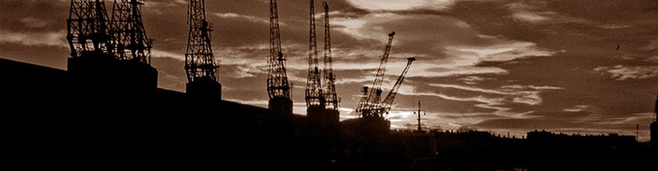 Black and white sepia image of Bristol docks at sunset
