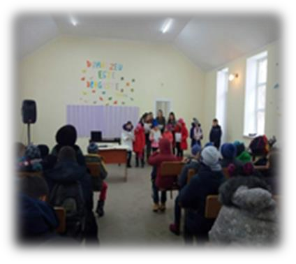 An image of people inside Pastor Misha's church building.